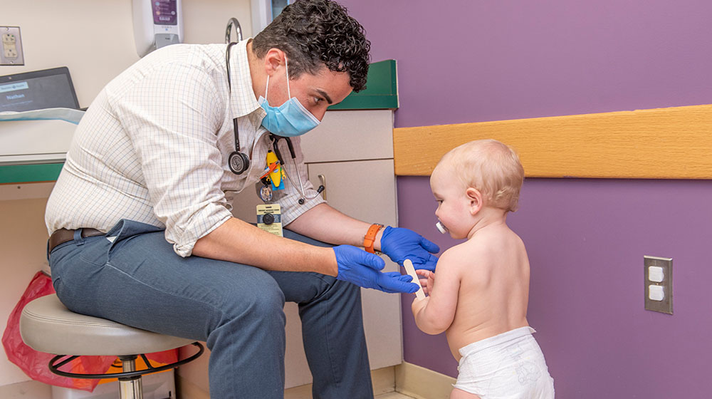 Family medicine physician with toddler patient