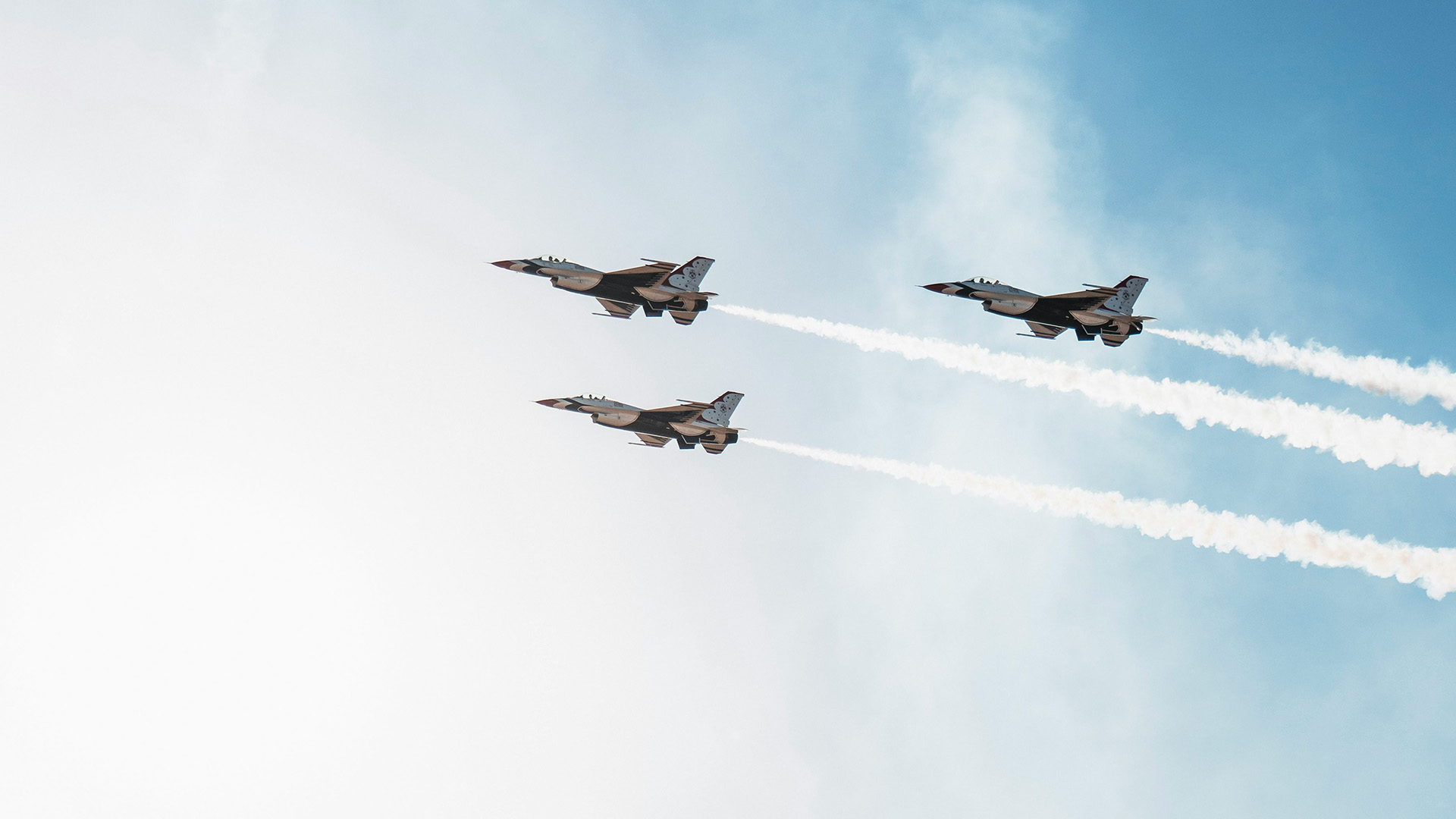 three military jets flying in formation