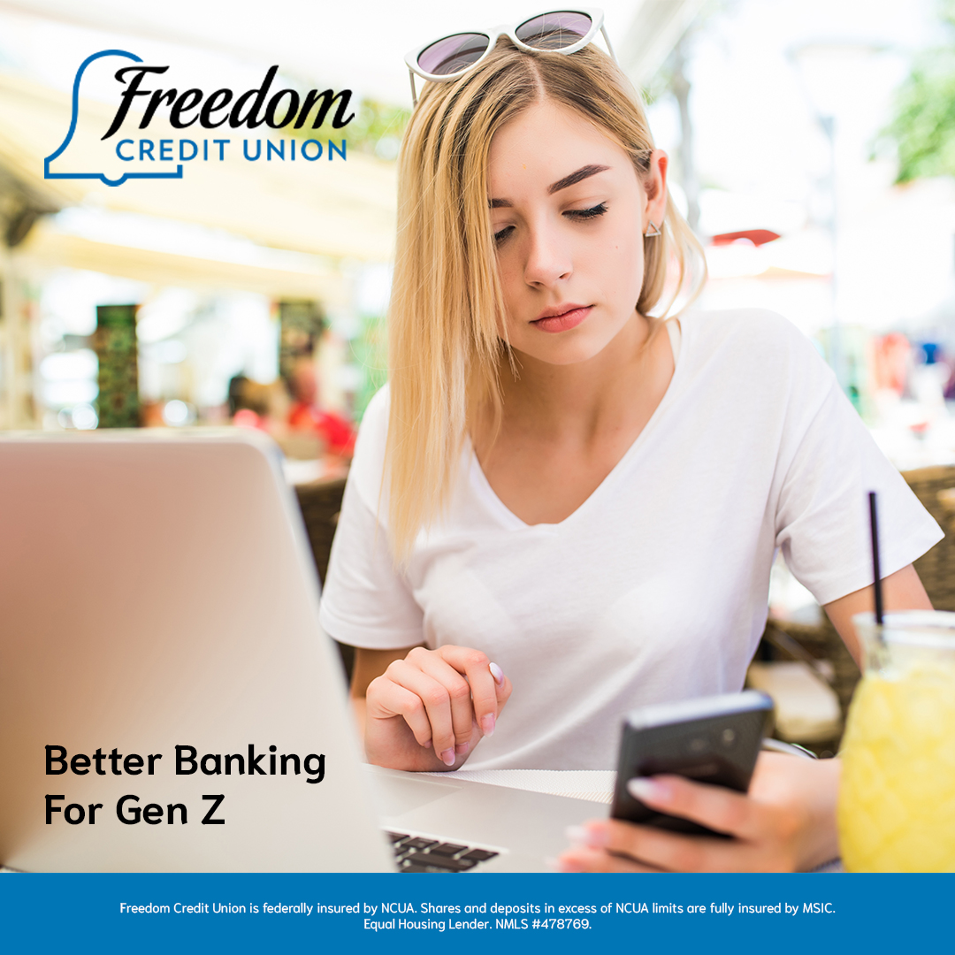 A Gen Z woman sitting at an outdoor café managing her finances on her smartphone and laptop