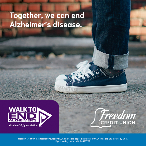 Laced up sneakers on a person ready to walk