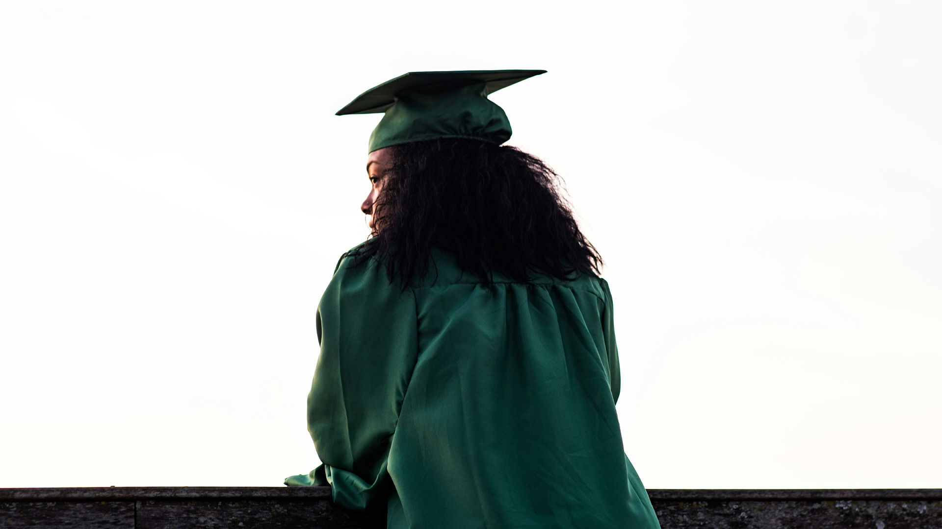 young woman in a graduation cap and gown