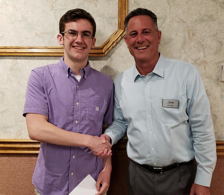  Tyler Dowd receiving scholarship from FCU Senior Vice President and CFO Jay Scungio