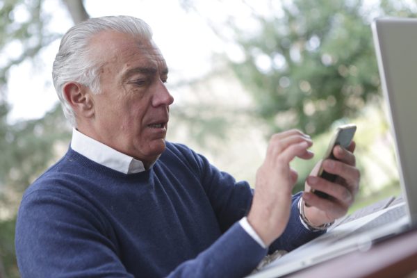 Older man using his smart phone