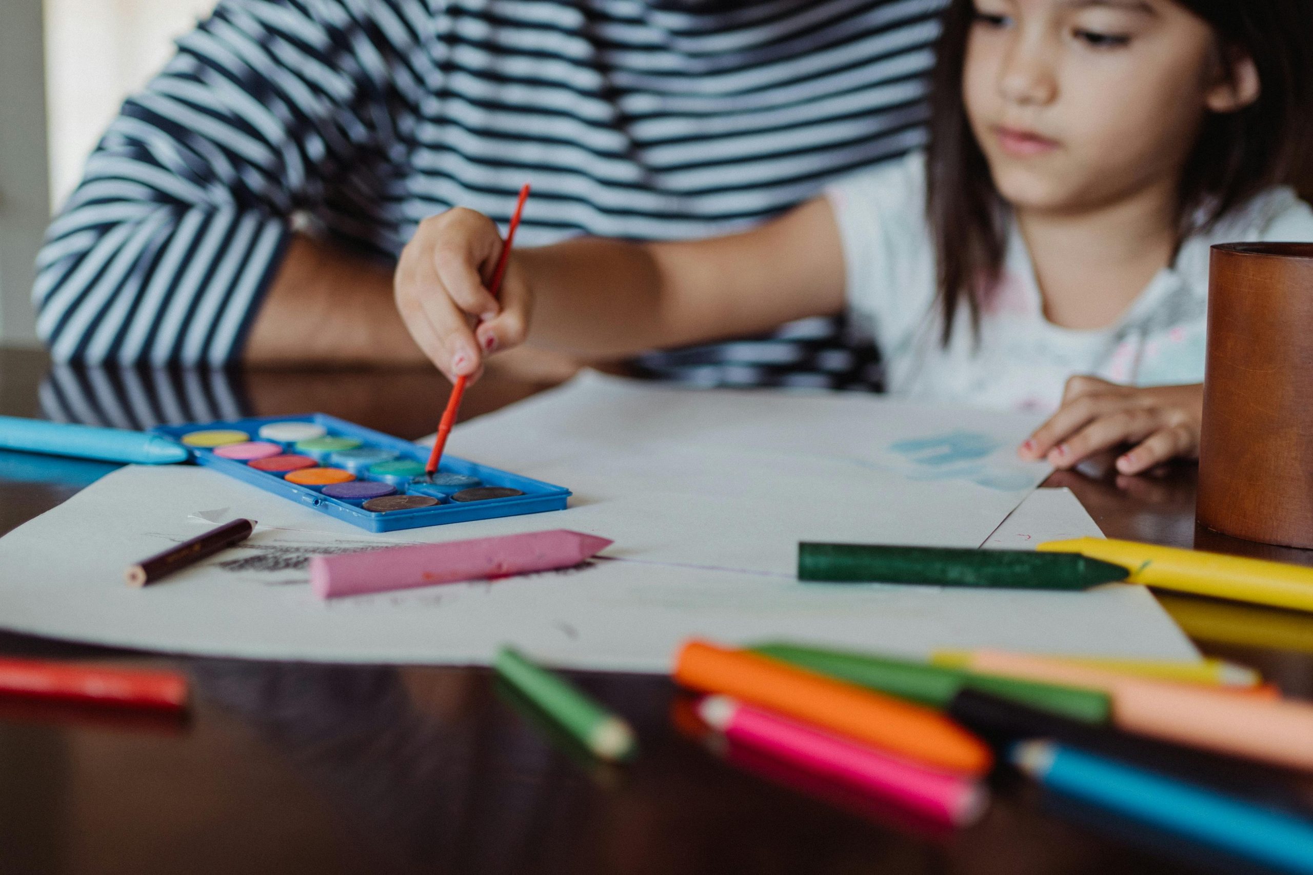 child painting with watercolors